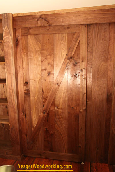 walnut hanging barn door on sliding track
